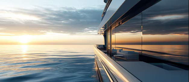 Luxury yacht on the water with a sunset in the background